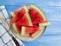 Watermelon ripe, nutritious yummy towel freshness sweet summertime on a blue wooden background Royalty Free Stock Photo