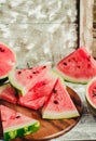 Watermelon slice on a blue rustic wood background.Summer fruit,