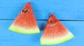 Watermelon slice on blue wooden background. Fruits, freshness, summer concept