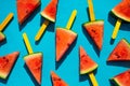 Watermelon slice popsicles on blue wood background. Royalty Free Stock Photo