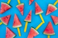 Watermelon slice popsicles on blue wood background. Royalty Free Stock Photo