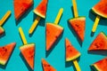 Watermelon slice popsicles on blue wood background. Royalty Free Stock Photo