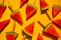 Watermelon slice popsicles on yellow wood background. Royalty Free Stock Photo