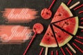 Watermelon slice with text Hello July, on dark background