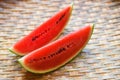 Watermelon slice on wood background - close up fresh watermelon pieces tropical summer fruit Royalty Free Stock Photo