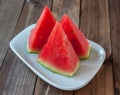 Watermelon sliced pieces on wooden background Royalty Free Stock Photo