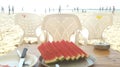 Watermelon slices on a dish on wooden table on the beach