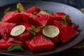 Fresh watermelon salad kept in a black plate on dark background Royalty Free Stock Photo