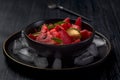 Fresh watermelon salad kept in a black plate on dark background Royalty Free Stock Photo