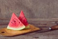 Watermelon slices on the woodan table. Fresh red watermelon. Rustical style.