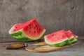 Watermelon slices on the woodan table. Fresh red watermelon. Rustical style.