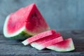 Watermelon slices on the woodan table. Fresh red watermelon. Rustical style.