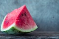 Watermelon slices on the woodan table. Fresh red watermelon. Rustical style.