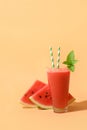Watermelon smoothie with shadow on beige. Close up. Royalty Free Stock Photo
