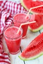 Watermelon smoothies on white wooden background