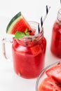 Watermelon smothie and slices with lime