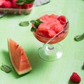 Watermelon sorbet or granita, refreshing summer dessert with strawberries, square image