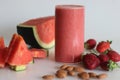 Watermelon strawberry smoothie. Summer drink made of watermelon and fresh strawberries in almond milk Royalty Free Stock Photo