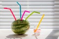 Watermelon summer juice drink. Fun colorful silicon straws in fruit