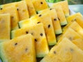 Watermelon, yellow, cut into triangles, close up. Summer refreshment