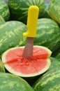 Watermelon with Yellow Knife Royalty Free Stock Photo