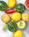 Watermelons, cantaloupes and sweet honeydew melon in a studio setting, isolated on white Royalty Free Stock Photo