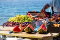 Watermelons, green and purple grapes, peaches in a boat in Croatia