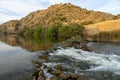 watermills from the guadiana in MÃÂ©rtola, where you can see a small waterfall due to the current of the river.