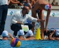 Waterpolo ball in the focus, the french team in the background