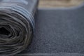 Waterproof bitumen roll covered with insulation materials, abstract background, closeup texture Royalty Free Stock Photo