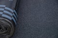 Waterproof bitumen roll covered with insulation materials, abstract background, closeup texture. Royalty Free Stock Photo