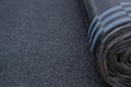 Waterproof bitumen roll covered with insulation materials, abstract background, closeup texture. Royalty Free Stock Photo