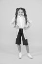 Waterproof concept. Small schoolgirl wear water resistant clothes. Cute schoolgirl feel protected. Happy schoolgirl wear