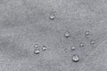 Waterproof droplets on fabric. Grey Canvas Polyester texture synthetical for background. Black polyester textile backdrop for Royalty Free Stock Photo