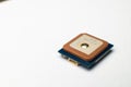 Waterproof GPS module with ceramic antenna on a white background in soft focus. Electronic components for hobby and Royalty Free Stock Photo