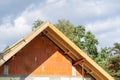 Waterproof layers on gable truss roof brick house in process of construction Royalty Free Stock Photo