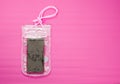 Waterproof Mobile Phone Case with Water Droplets on Pink Mat Background. Plastic PVC Waterproof Case for Smartphone, Zip