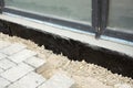 Waterproofing house foundation with spray on tar Royalty Free Stock Photo