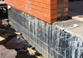 Waterproofing foundation walls. Foundation Waterproofing Coatings. Royalty Free Stock Photo