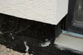 Waterproofing house foundation with spray on tar