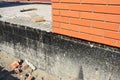 Waterproofing a new brick house foundation with spray on tar. Construction techniques for waterproofing basements and foundations Royalty Free Stock Photo