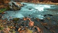 Waters of the autumn Chuya river in the Altai mountains, streams of water over stones