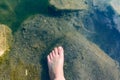 The waters of the basalt lake, the stones in the lake are covered with algae, clear and pure water