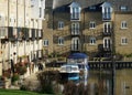 Waterside Apartments with Balconies and Boats in water Cambridgeshire UK.. Royalty Free Stock Photo