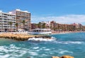 Waterside distant view Playa del Cura beach, urban skyline typical high rise houses coastal restaurant building