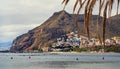 Waterside distant view to Playa de Las Teresitas beach picturesque famous place for tourists, hillside town houses mountainous Royalty Free Stock Photo