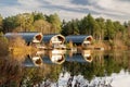 Waterside lodges by the lake at Center Parcs in the United Kingdom. Royalty Free Stock Photo