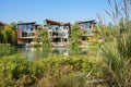 Waterside modern dwelling buildings in sunny winter afternoon