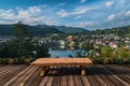 Waterside retreat Empty wooden table with a tranquil lake vista