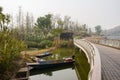 Waterside sanitation boasts under footbridge in sunny winter aft